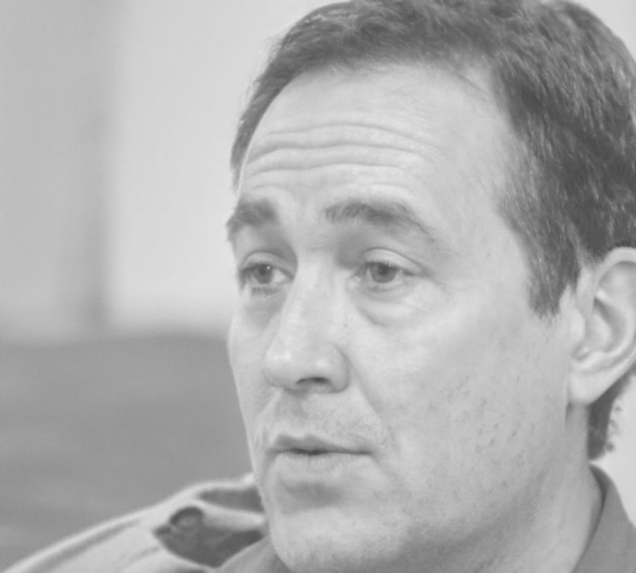 Portrait of Riordan Ashbrook, senior instructor specializing in regulatory compliance