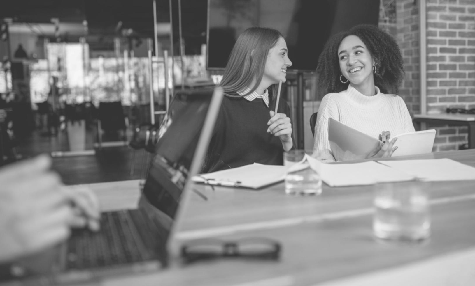 Student reviewing financial statements with multiple documents and calculator during structured remote learning