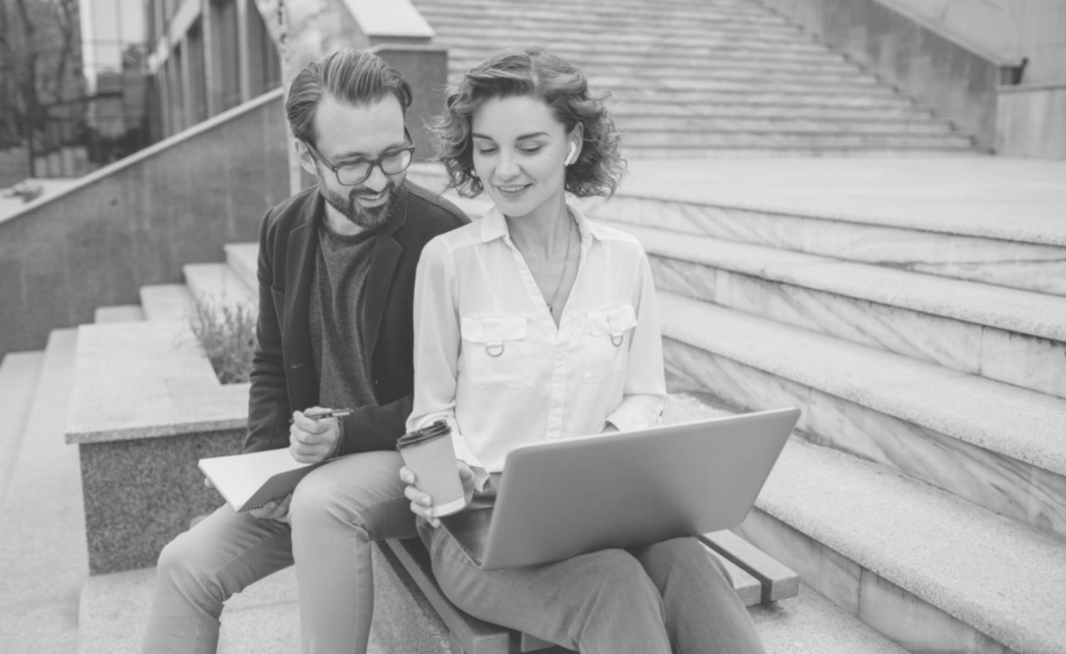 Interactive workshop session with instructor reviewing financial statements with small group of students